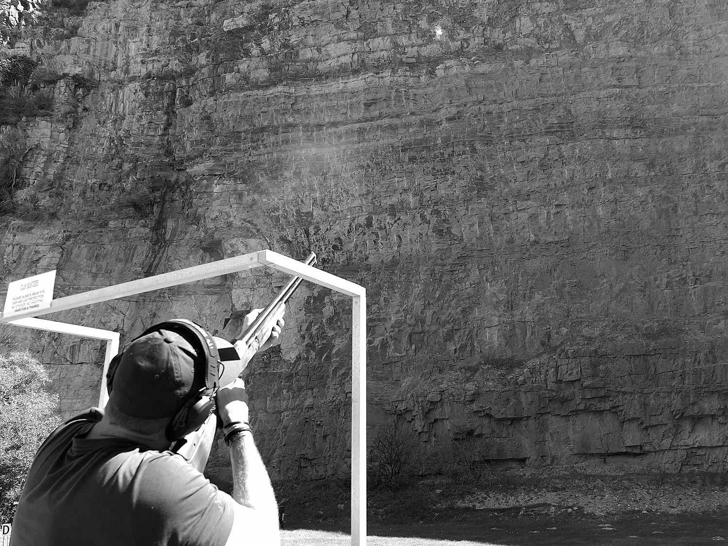 The shot breaks, smoke hanging on the line at Clay Busters